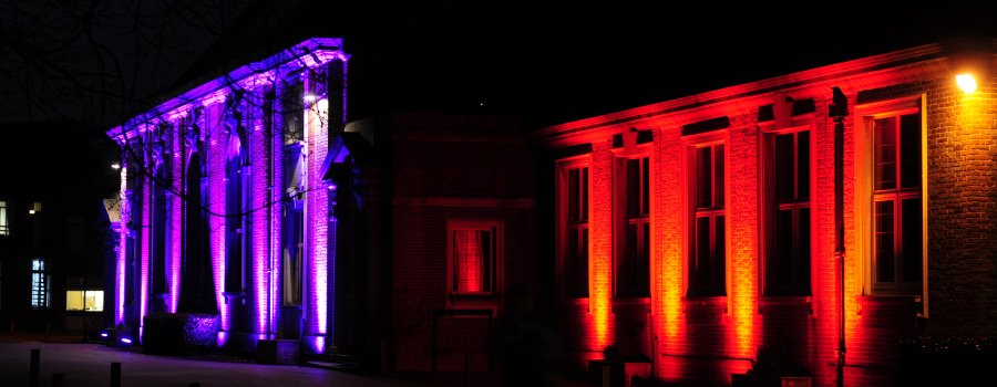 outdoor lighting up buildings with various colours