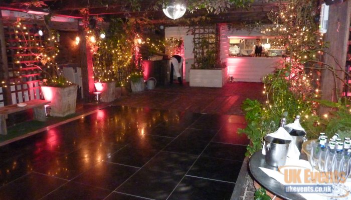 a shiny black dance floor used on a roof tarrace