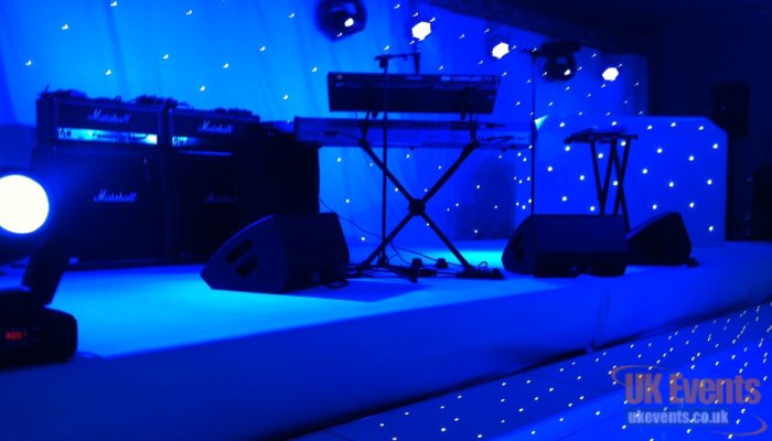 a band stage dressed in black carpet at 30cm high