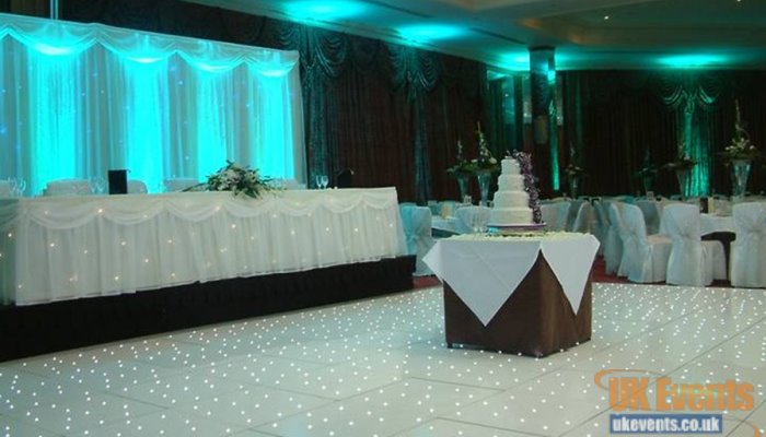 A white starlit dance floor for a wedding reception